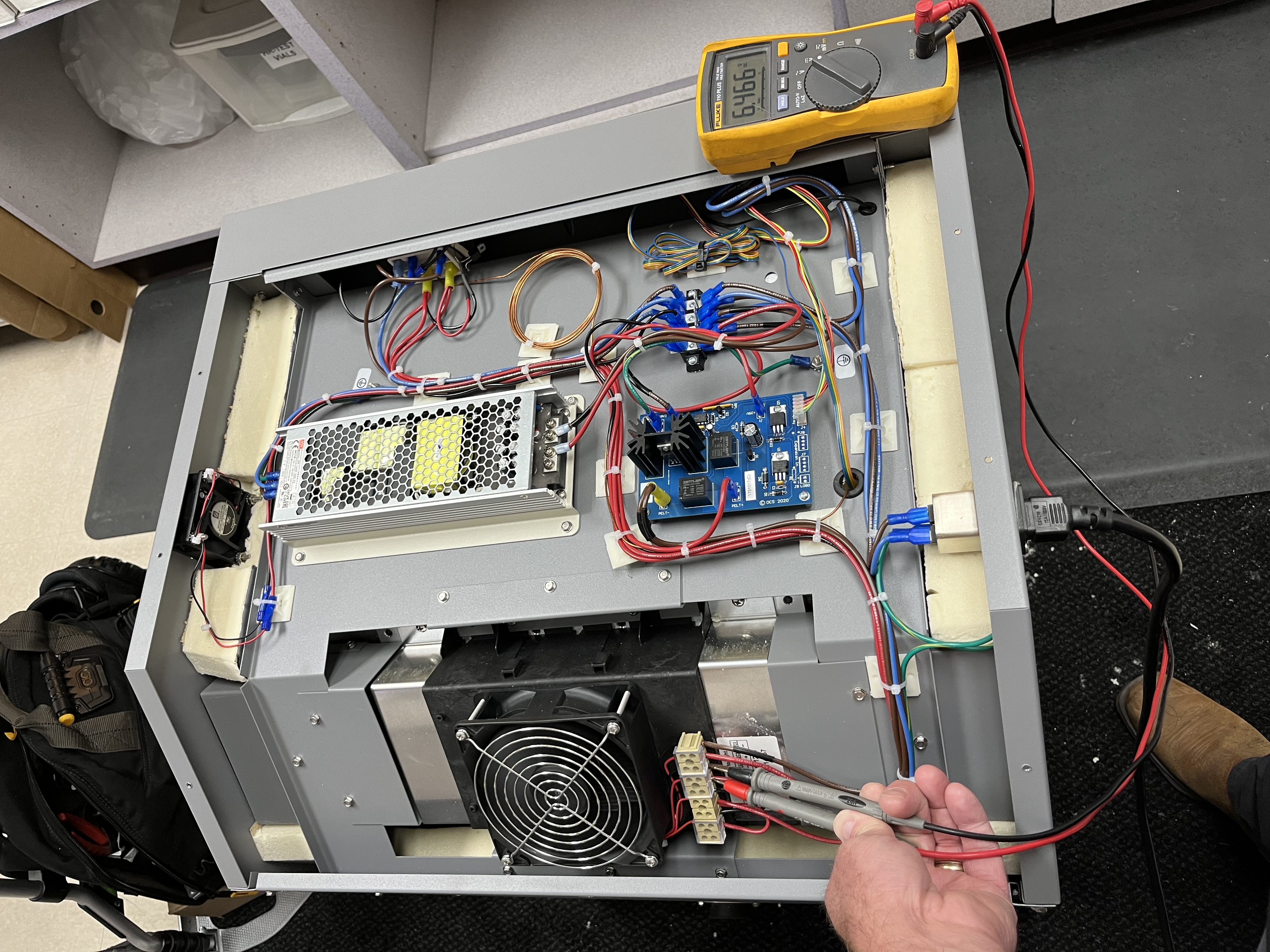Index Services technician troubleshooting equipment electronics